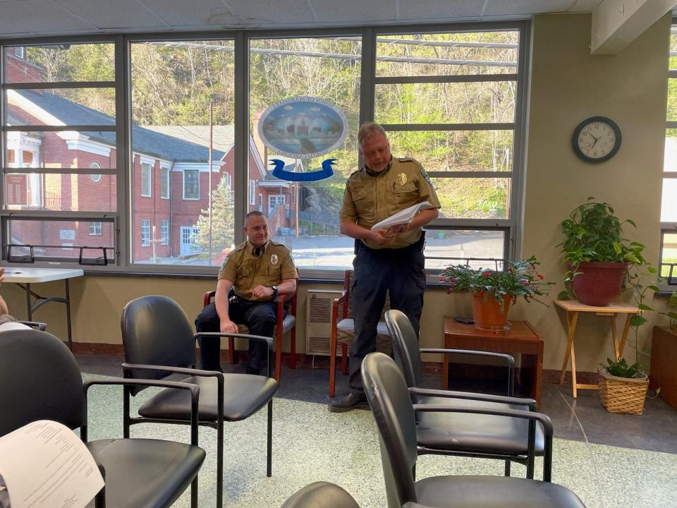 Marshall Police Chief Mike Boone, right, recognized Officer Tori Murdoch in the Marshall Town Board's April 15 meeting.