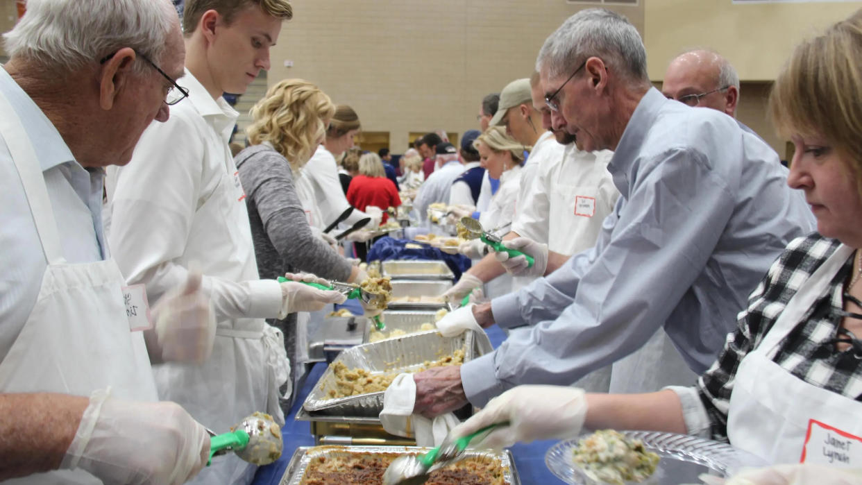 The Holland Rescue Mission serves more than 1,000 people a traditional Thanksgiving dinner at DeVos Fieldhouse each year.