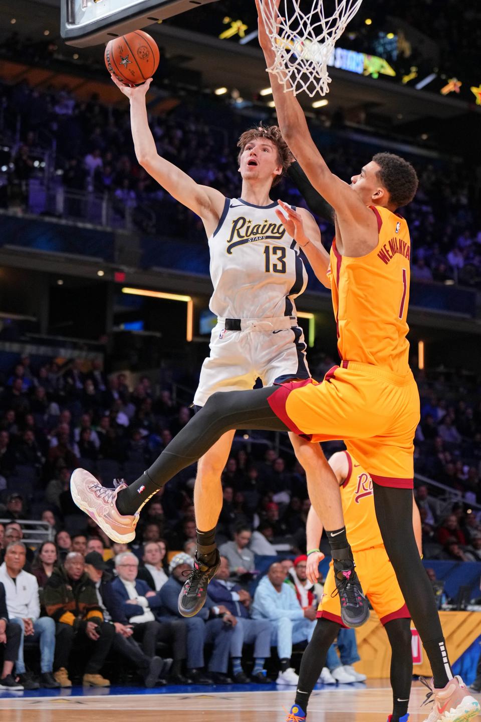 Team Detlef forward Matas Buzelis of the G League Ignite shoots the ball against Team Pau's Victor Wembanyama of the San Antonio Spurs during a Rising Stars semifinal game at Gainbridge Fieldhouse, Feb. 16, 2024 in Indianapolis.