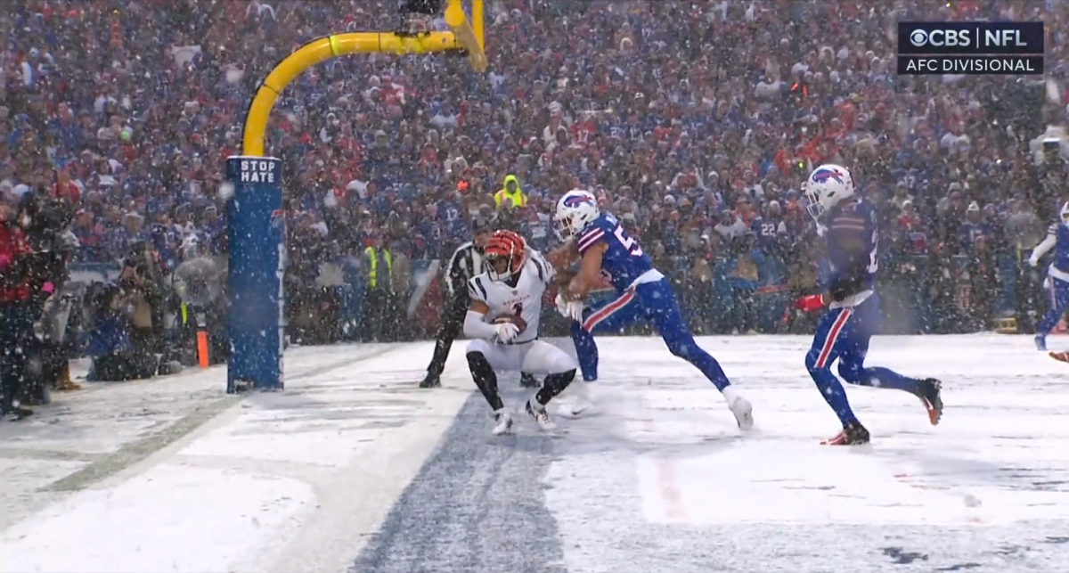 Cincinnati Bengals wide receiver Ja'Marr Chase (1) attempts to break the  tackle of Buffalo Bills cornerback Tre'Davious White (27) during an NFL  divisional round playoff football game Sunday, Jan. 22, 2023, in