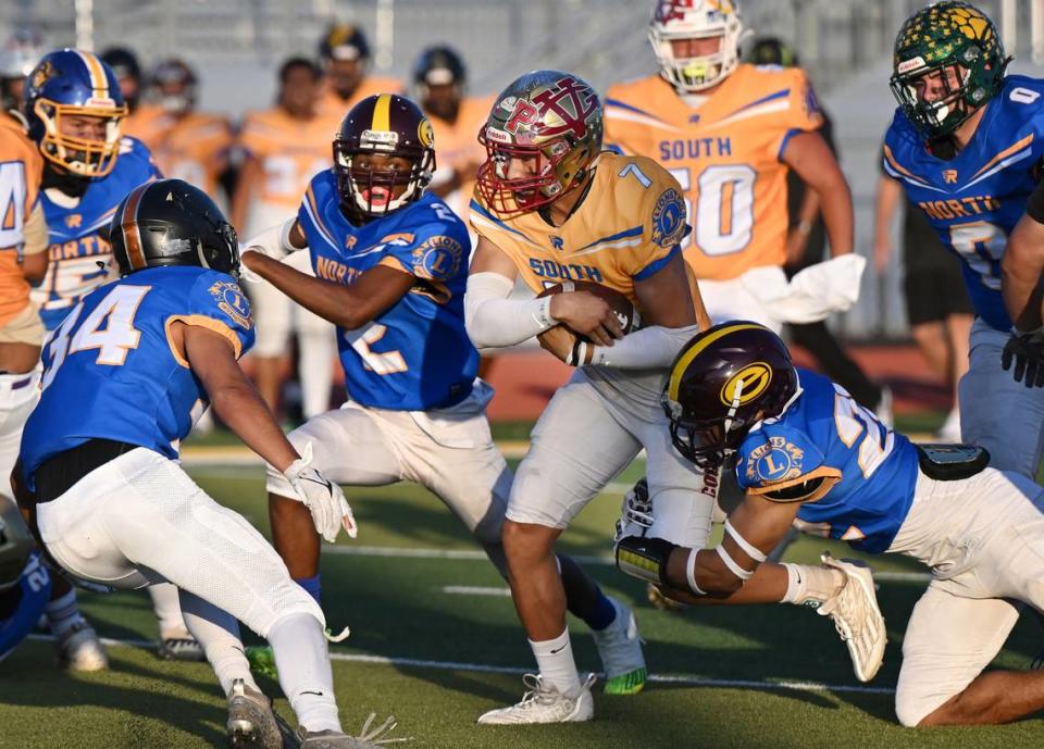 South team quarterback Eleazar Garcia (Golden Valley) runs the ball during the Central California Lions All-Star Football Game at Tracy High School in Tracy, Calif., Saturday, June 24, 2023. The South won the game 38-13. Andy Alfaro/aalfaro@modbee.com