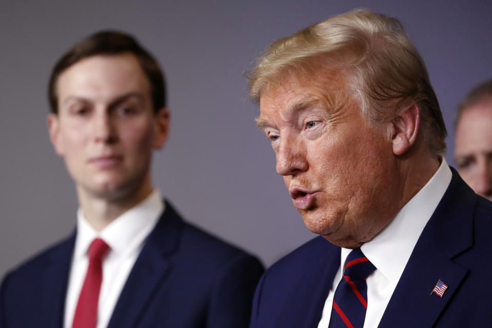 President Donald Trump speaks about the coronavirus in the James Brady Press Briefing Room of the White House, Thursday, April 2, 2020, in Washington, as White House adviser Jared Kushner listens. (AP Photo/Alex Brandon)