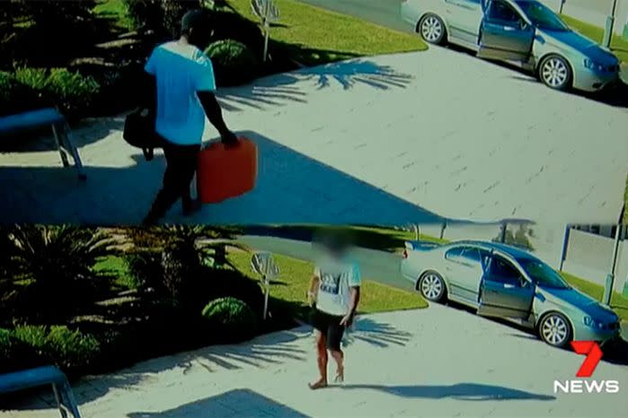 As casually as you like, the thief strolls in and out of the garage twice, loading tools into his stolen getaway car. Source: 7 News