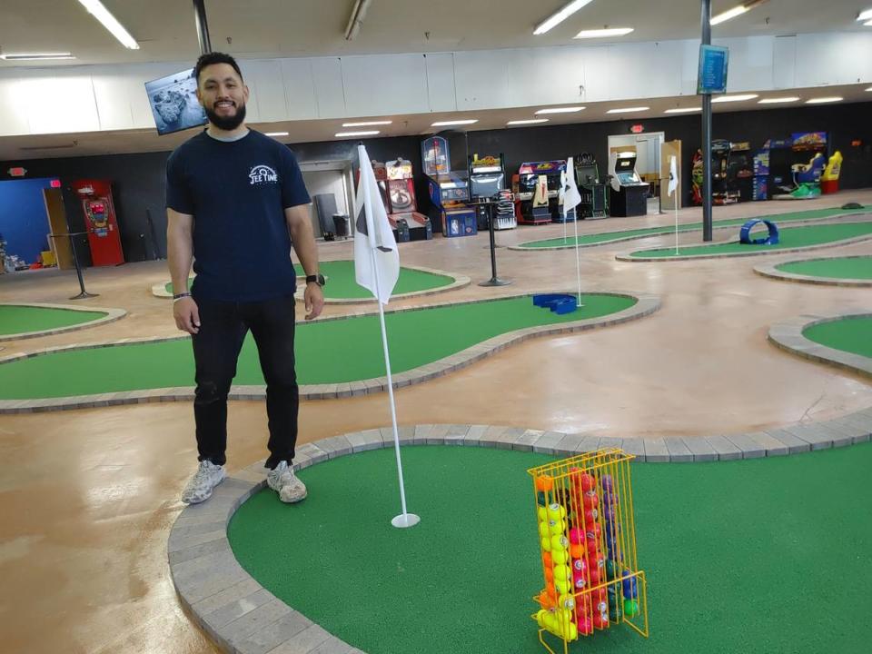 Reyes Gonzales poses at Tee Time, the Tri-Cities newest indoor mini golf facility. The 18-hole course is an all-ages destination and celebrates its grand opening with food trucks, face painting and more on Friday, May 3. Tri-City Herald staff
