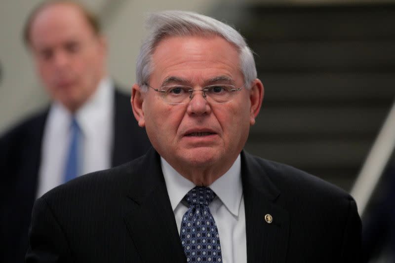 Senator Bob Menendez exits at the end of the day as the Trump impeachment trial continues in Washington