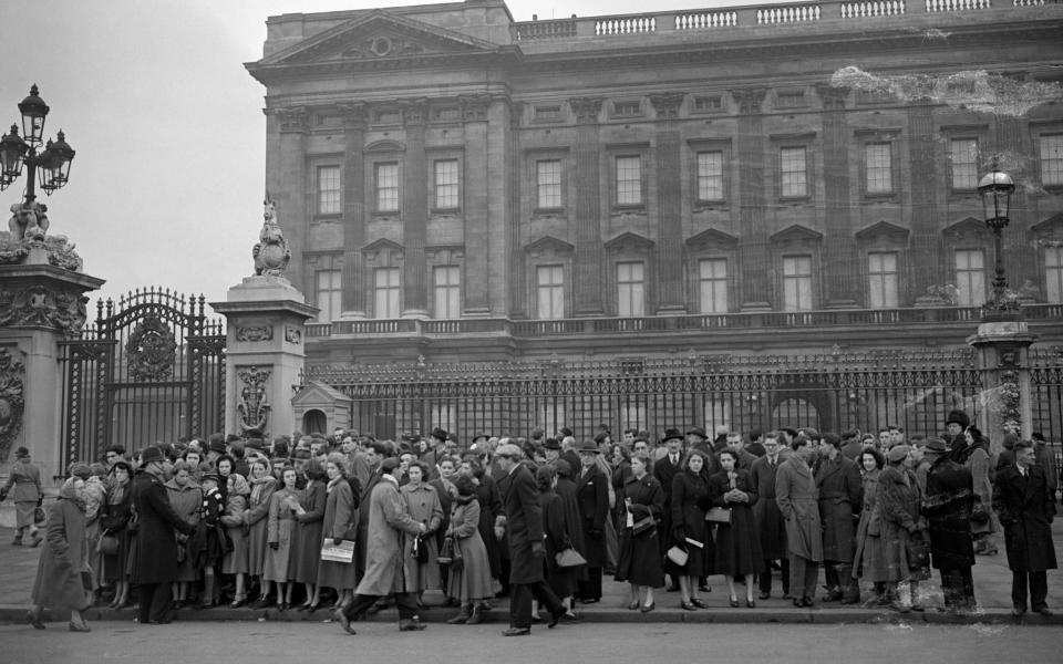 Crowds mass outside Buckingham Palace following the news of the sudden death of King George VI - PA Archive
