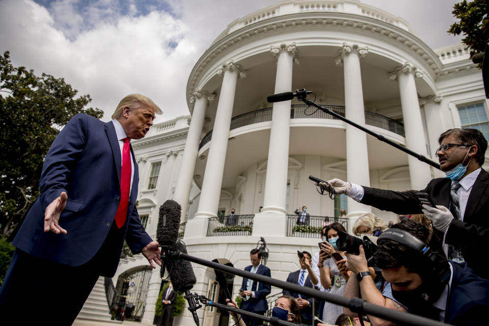 President Donald Trump speaks with members of the media before boarding Marine One on the South Lawn of the White House in Washington, Thursday, Aug. 6, 2020, for a short trip to Andrews Air Force Base, Md. and then on to Cleveland, Ohio. (AP Photo/Andrew Harnik)