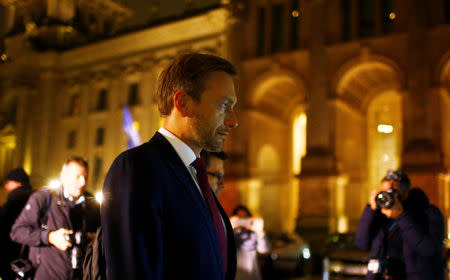 Chairman of the Free Democratic Party (FDP) Christian Lindner leaves the German Parliamentary Society after exploratory talks about forming a new coalition government in Berlin, Germany, November 17, 2017. REUTERS/Hannibal Hanschke