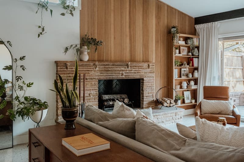 Wood panels above fireplace after renovation.