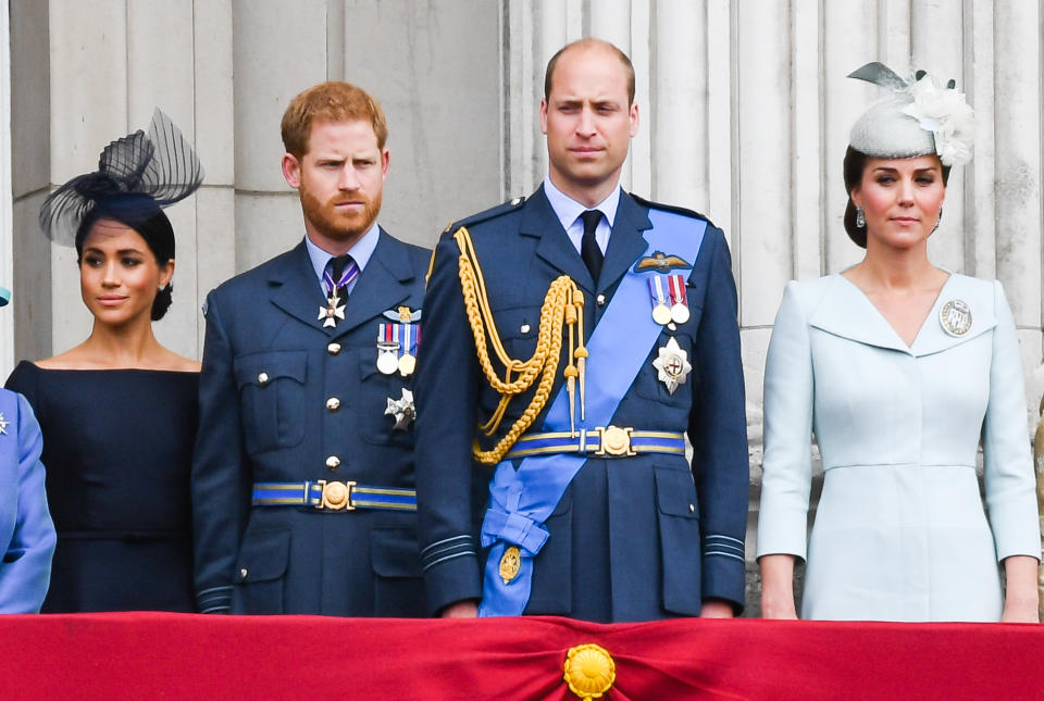 LONDON,  UNITED KINGDOM - JULY 1O:  Meghan, Duchess of Sussex, Prince Harry, Duke of Sussex, Prince William, Duke of Cambridge and Catherine, Duchess of Cambridge stand on the balcony of Buckingham Palace to view a flypast to mark the centenary of the Royal Air Force (RAF)  on July 10, 2018 in London, England. (Photo by Anwar Hussein/WireImage)