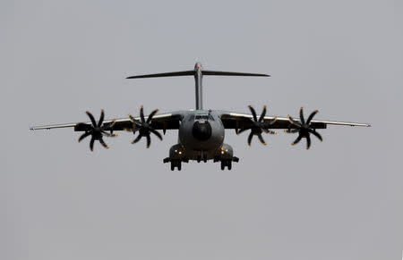 An Airbus A400M military plane flies before landing during a test flight at the airport of the Andalusian capital of Seville May 12, 2015. REUTERS/Marcelo del Pozo