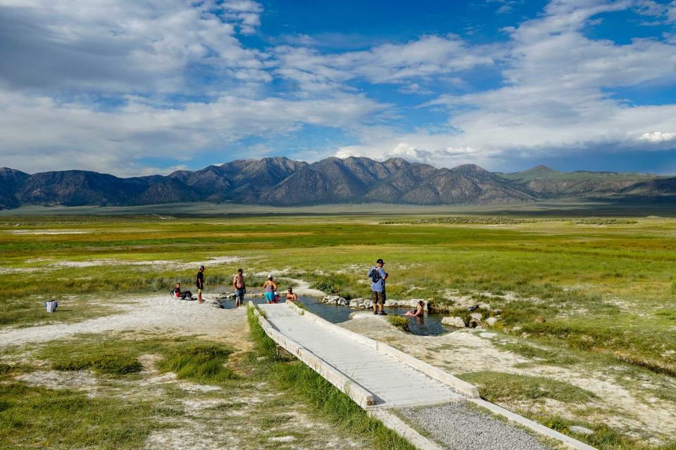 Families and kids enjoying Wild Willy's Hot Spring in Long Valley