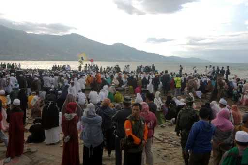 Thousands gathered for an emotional prayer service at the spot where an 11-metre tsunami smashed into the Indonesia town of Palu