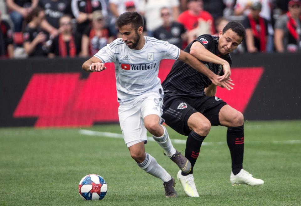 WASHINGTON, DC - APRIL 06: Los Angeles FC forward Diego Rossi (9) turns from DC United defender Leonardo Jara (29) during a MLS match between D.C United and Los Angeles FC on April 6, 2019, at Audi Field, in Washington D.C. (Photo by Tony Quinn/Icon Sportswire via Getty Images)