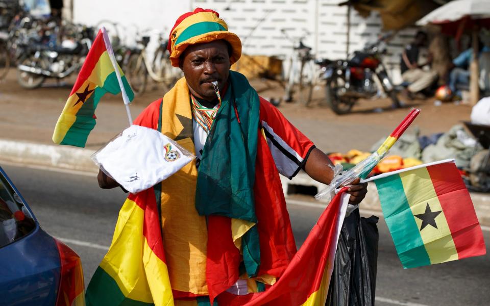 A street vendor sells Ghanaian flags in Accra Thursday, Nov. 24, 2022 ahead of the World Cup soccer match - PA