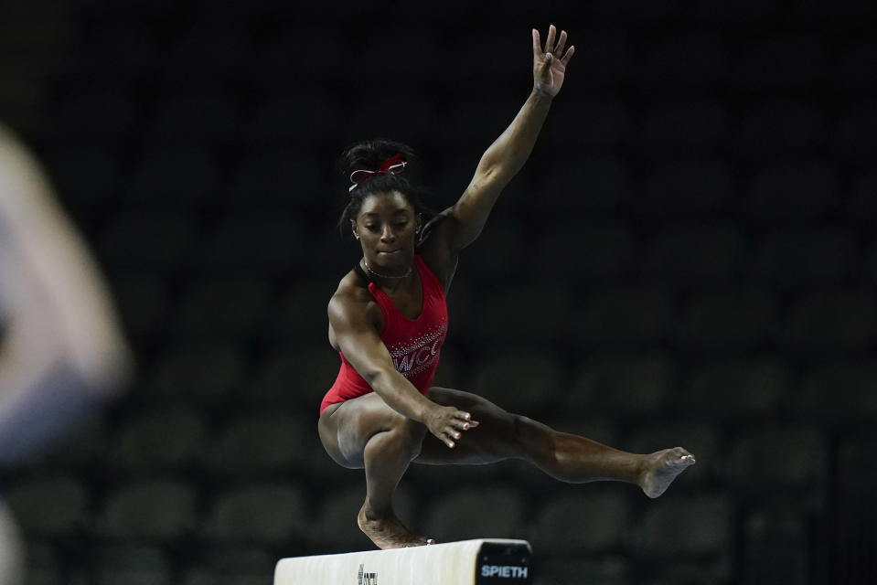 Simone Biles, a seven-time Olympic medalist and the 2016 Olympic champion, practices on the balance beam at the U.S. Classic gymnastics competition Friday, Aug. 4, 2023, in Hoffman Estates, Ill. (AP Photo/Morry Gash)