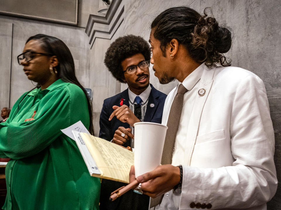 Image: Democratic state Reps. Justin Pearson, center, of Memphis and Justin Jones, right, of Nashville attend the vote in which they were expelled from the state Legislature on April 6, 2023 in Nashville, Tenn. (Seth Herald / Getty Images)