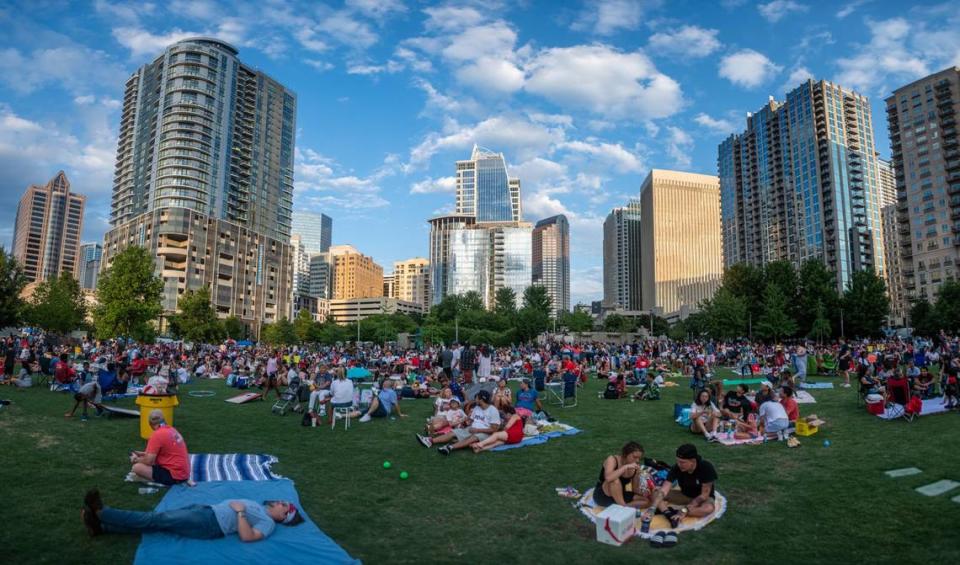 A composite panorama of spectators gathered in Romare Bearden Park before an Independence Day fireworks display after the USA Baseball Stars vs. Stripes game July 4, 2022 at Trust Field in Charlotte, N.C.