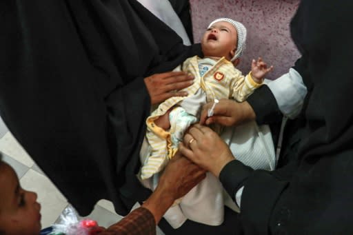 A Yemeni child receives a polio vaccination during an immunisation campaign at a health centre on the outskirts of the capital Sanaa on November 26, 2018