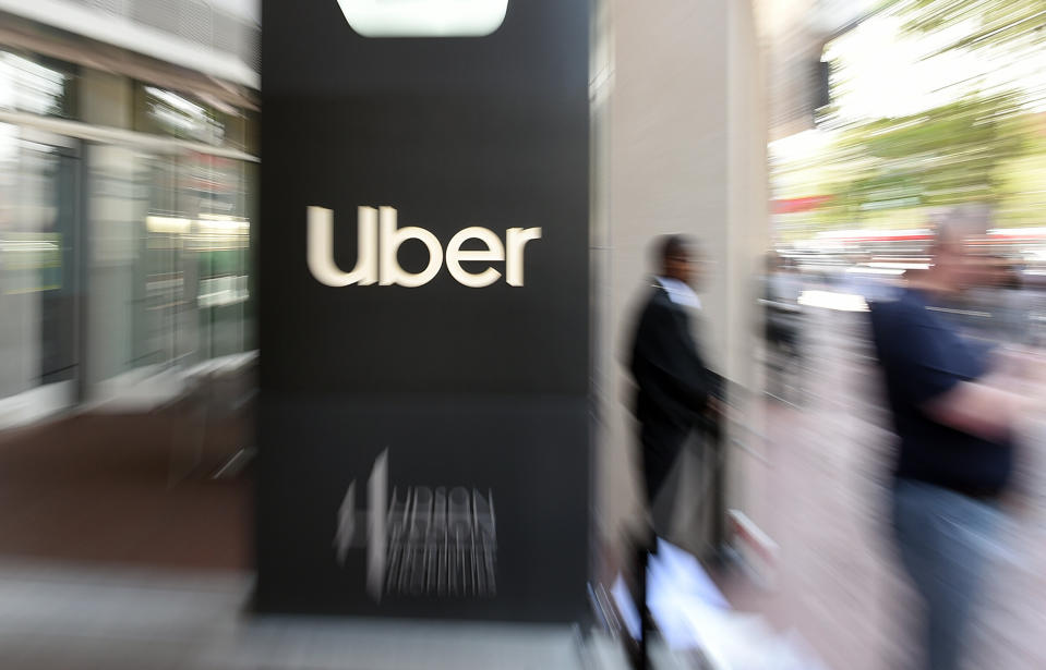 In this pan zoom image, an Uber logo is seen outside the company's headquarters in San Francisco, California on May 8, 2019. - One of the early promises of the ride-hailing era ushered in by Uber and Lyft was that the new entrants would complement public transit, reduce car ownership and help alleviate congestion. But a new study on San Francisco has found the opposite may be in fact be true: far from reducing traffic, the companies increased delays by 40 percent as commuters ditched buses or walking for mobile-app summoned rides. (Photo by Josh Edelson / AFP)        (Photo credit should read JOSH EDELSON/AFP/Getty Images)