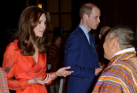 Britain's Prince William (C), Duke of Cambridge and his wife Catherine (L), Duchess of Cambridge, attend a reception celebrating United Kingdom and Bhutanese friendship and cooperation in Thimphu, Bhutan, April 15, 2016. REUTERS/Mark Large/Pool