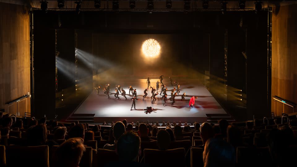 During one number staged inside the theater, the acoustic wall was removed to open the space into the warehouse behind. - Marco Cappelletti/Courtesy of OMA and Factory International