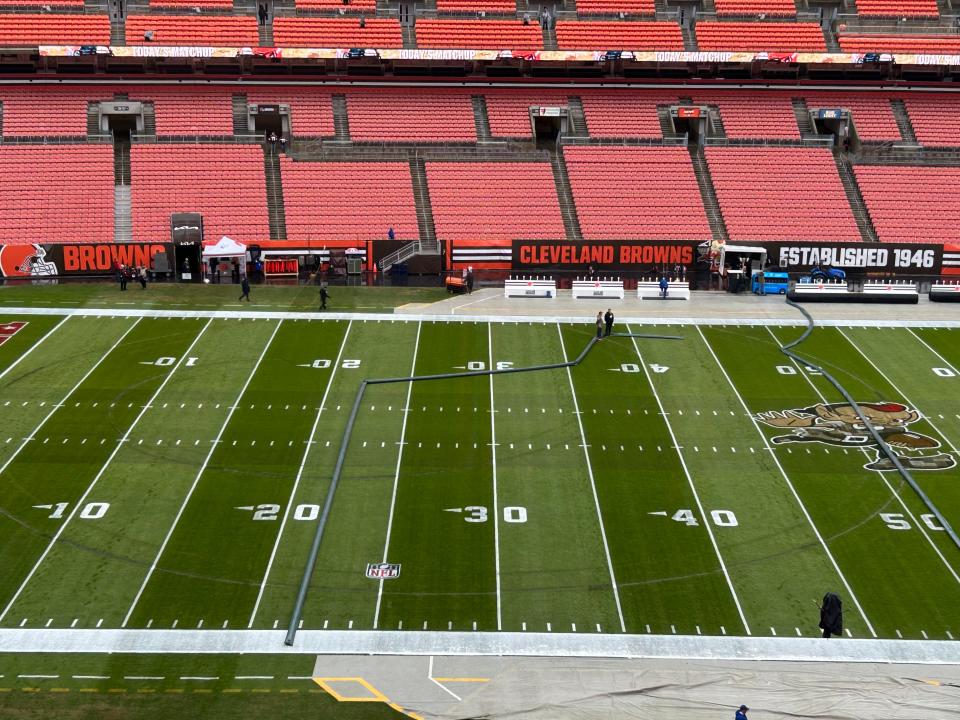 Tire tracks cover the turf at the Browns stadium prior to their game against the Tampa Bay Buccaneers, Sunday, Nov. 27, 2022.