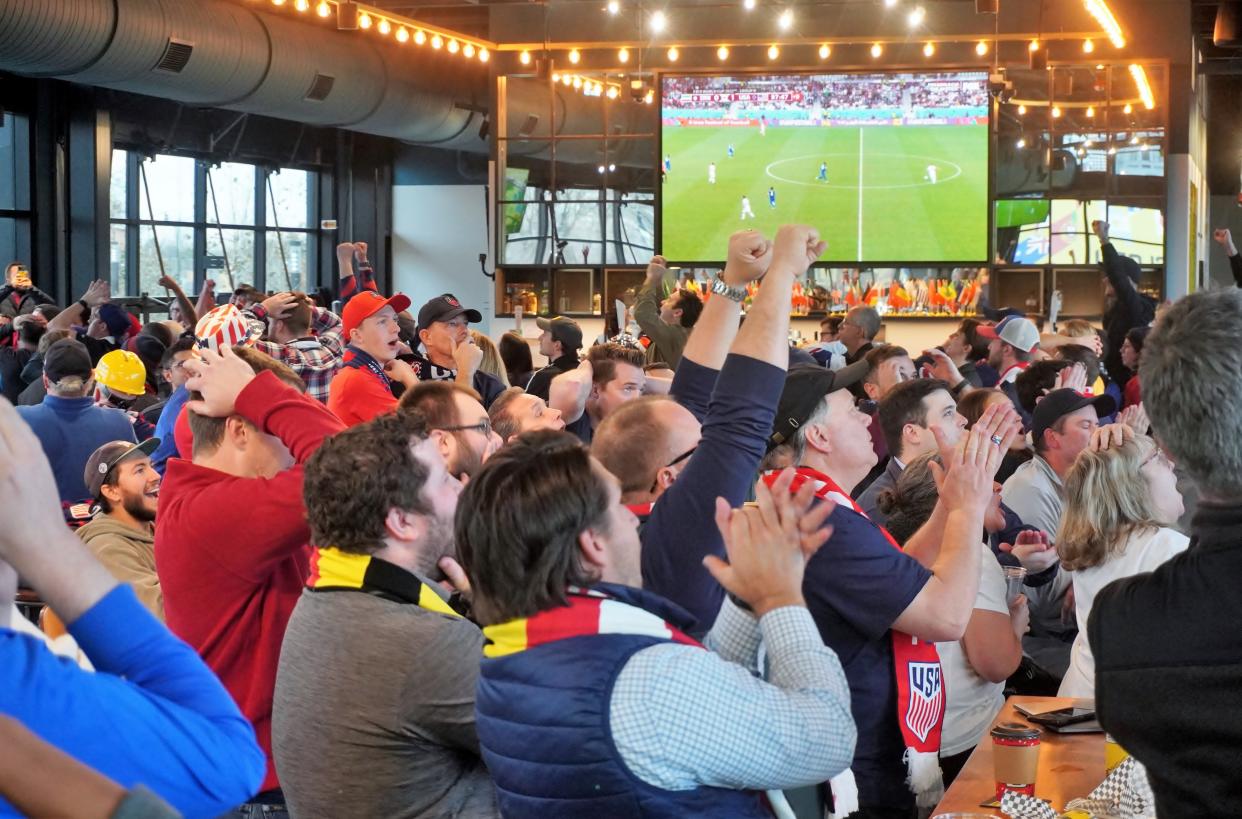 Fans of the United State's men's soccer team watch from The Pub restaurant at Lower.com Field as Team USA beats Iran 1-0 on Nov. 29, 2002.