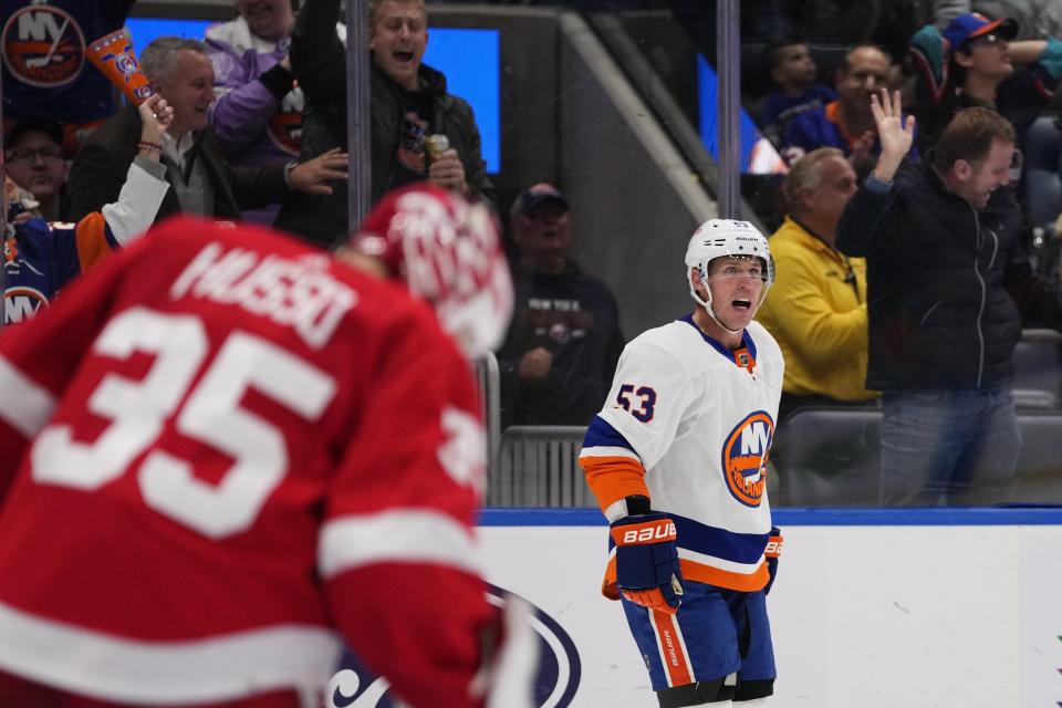 New York Islanders' Casey Cizikas celebrates after scoring a goal as Detroit Red Wings goaltender Ville Husso (35) looks down during the second period of an NHL hockey game, Monday, Oct. 30, 2023, in Elmont, N.Y. (AP Photo/Frank Franklin II)
