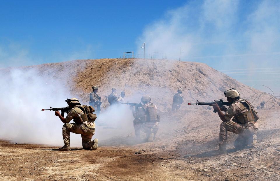 Australian and New Zealand coalition forces participate in a training mission with Iraqi army soldiers at Taji Base, north of Baghdad, Iraq, Wednesday, April 17, 2019. A month after the defeat of the Islamic State group in Syria and Iraq, the U.S.-led international coalition has turned its attention to training Iraqi forces to secure the country against lingering threats posed by IS cells operating in the countryside. (AP Photo/Hadi Mizban)