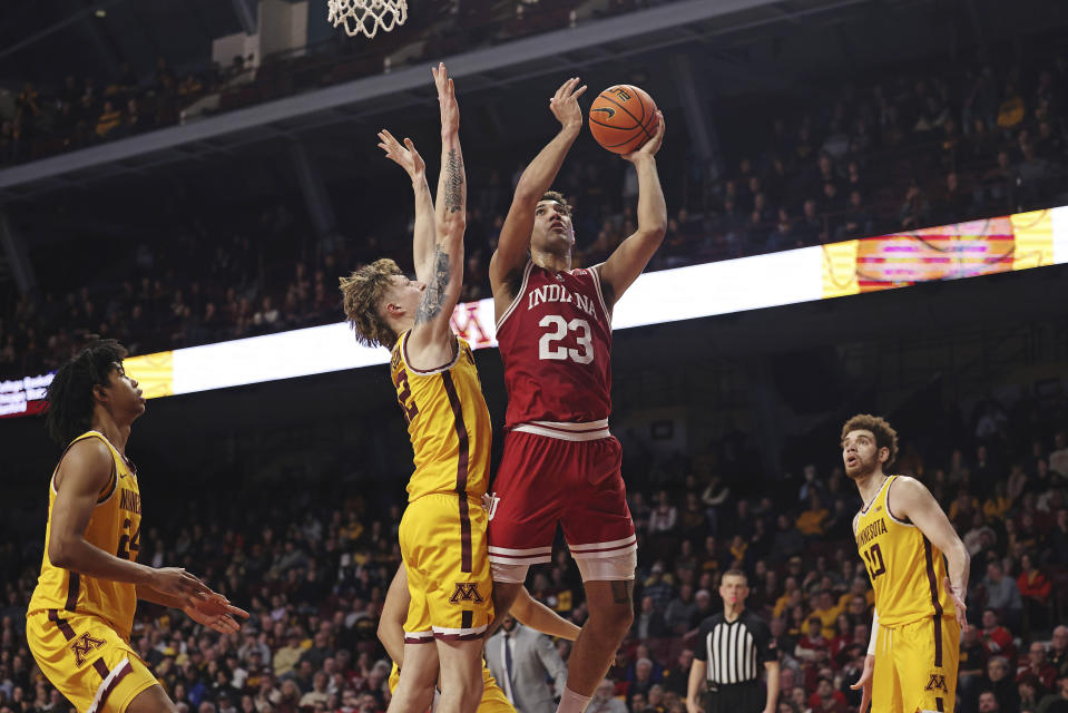 Indiana forward Trayce Jackson-Davis (23) goes to the basket against Minnesota center Treyton Thompson (42) during the second half of an NCAA college basketball game Wednesday, Jan. 25, 2023, in Minneapolis. Indiana won 61-57. (AP Photo/Stacy Bengs)