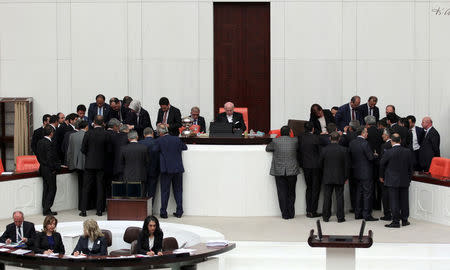 Lawmakers watch the counting of votes for an article of constitutional change that could see pro-Kurdish and other lawmakers prosecuted, at the Turkish parliament in Ankara, Turkey, May 20, 2016. REUTERS/Umit Bektas