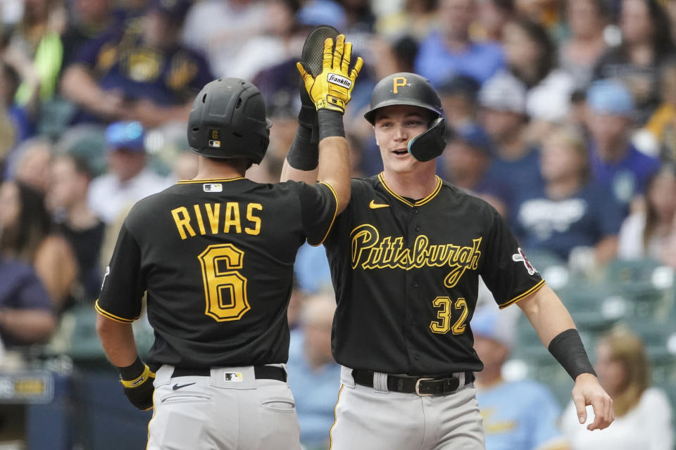 Pittsburgh Pirates' Alfonso Rivas (6) is congratulated by Henry Davis (32) after hitting a three-run home run during the first inning of a baseball game against the Milwaukee Brewers, Friday, Aug. 4, 2023, in Milwaukee. (AP Photo/Aaron Gash)