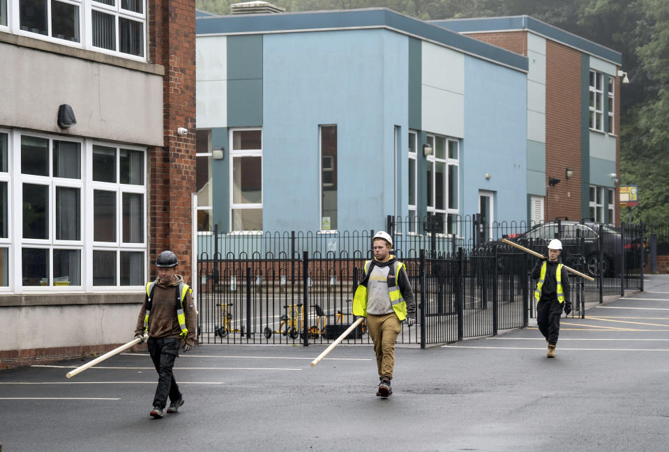 Workmen at Abbey Lane Primary School in Sheffield, which has been affected with sub standard reinforced autoclaved aerated concrete (RAAC). More than 100 schools, nurseries and colleges in England have been told by the Government to close classrooms and other buildings that contain an aerated concrete that is prone to collapse. Picture date: Friday September 1, 2023. (Photo by Danny Lawson/PA Images via Getty Images)