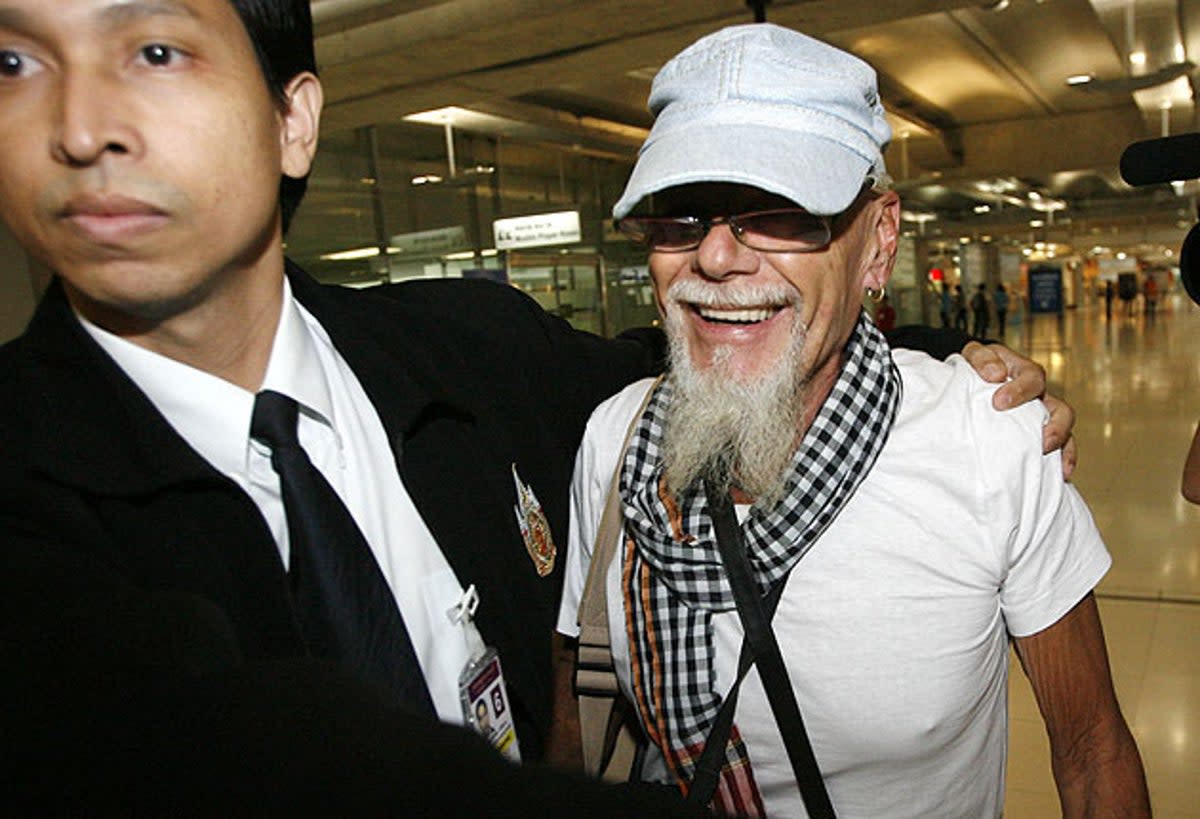 Gary Glitter walks at Bangkok's Suvarnabhumi Airport (Reuters)