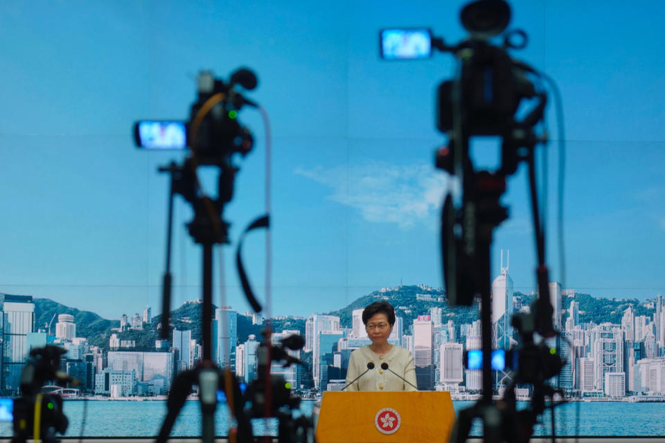 Hong Kong Chief Executive Carrie Lam listens to reporters' questions during a press conference in Hong Kong, Tuesday, July 7, 2020. TikTok said Tuesday it will stop operations in Hong Kong, joining other social media companies in warily eyeing ramifications of a sweeping national security law that took effect last week. (AP Photo/Vincent Yu)