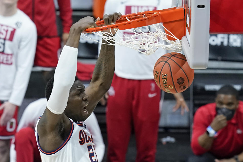 Illinois's Kofi Cockburn dunks during the first half of an NCAA college basketball game against Ohio State at the Big Ten Conference championship, Sunday, March 14, 2021, in Indianapolis. (AP Photo/Darron Cummings)