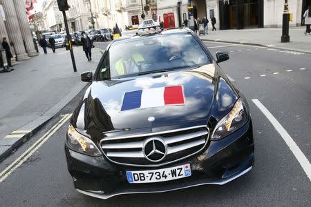 A french taxi joins a protest by London cab drivers against Uber in central London, Britain February 10, 2016. REUTERS/Stefan Wermuth