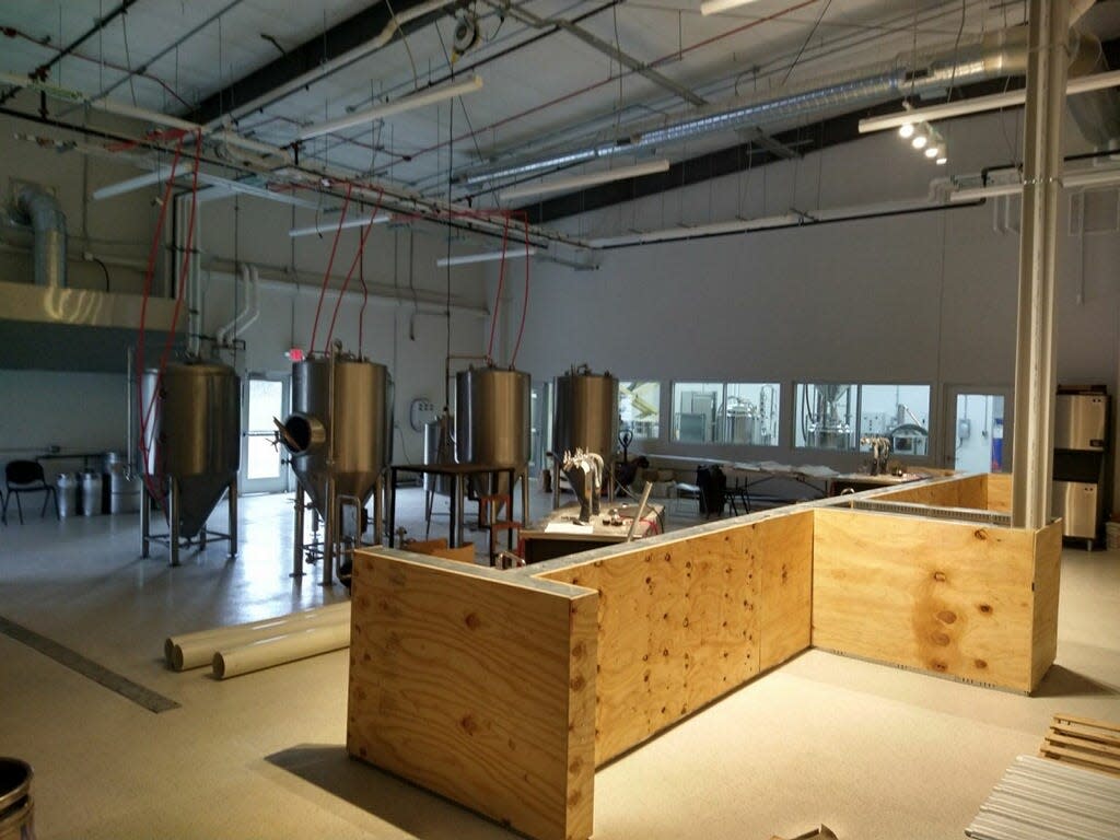 Black Diamond Brewery and Distillation is already working on adding a tasting room and bar. The brewery and distillery area can be seen beyond the bar, which is under construction.