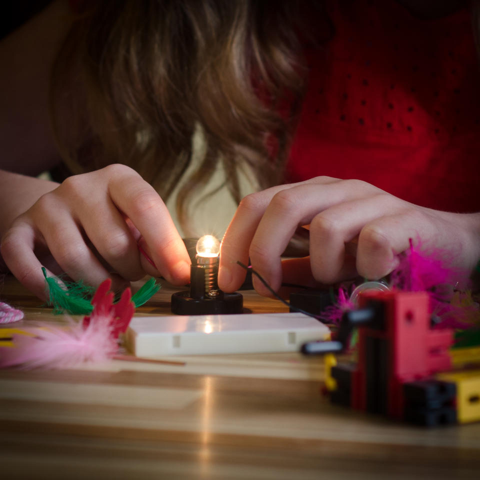 Girl playing win an electronics set