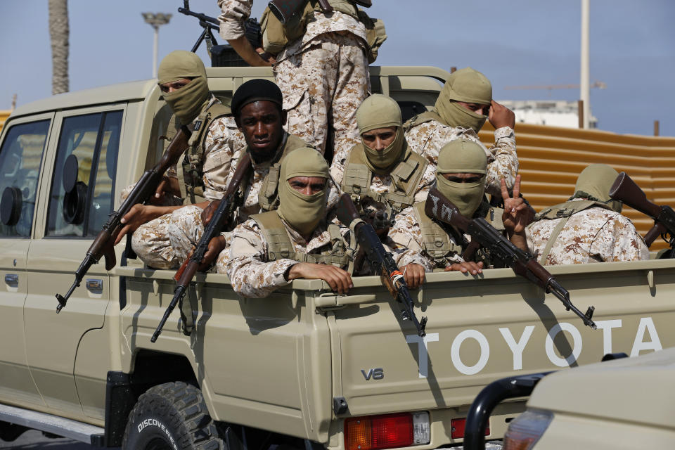 Forces loyal to Abdul Hamid Dbeibah, one of Libya’s two rival prime ministers, secure the streets of the capital, Tripoli, Tuesday May, 17, 2022. Clashes broke out in Tripoli after Dbeibah’s rival, Prime Minister Fathi Bashagha, announced his arrival in the city on Tuesday morning. But Bashagha left soon after the fighting started. (AP Photo/Yousef Murad)