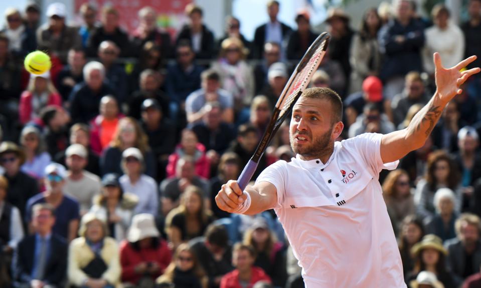 Britain's Daniel Evans returns the ball to Spain's Fernando Verdasco during their men's singles first round match on day three of The Roland Garros 2019 French Open tennis tournament in Paris on May 28, 2019. (Photo by Christophe Archambault/AFP/Getty Images)