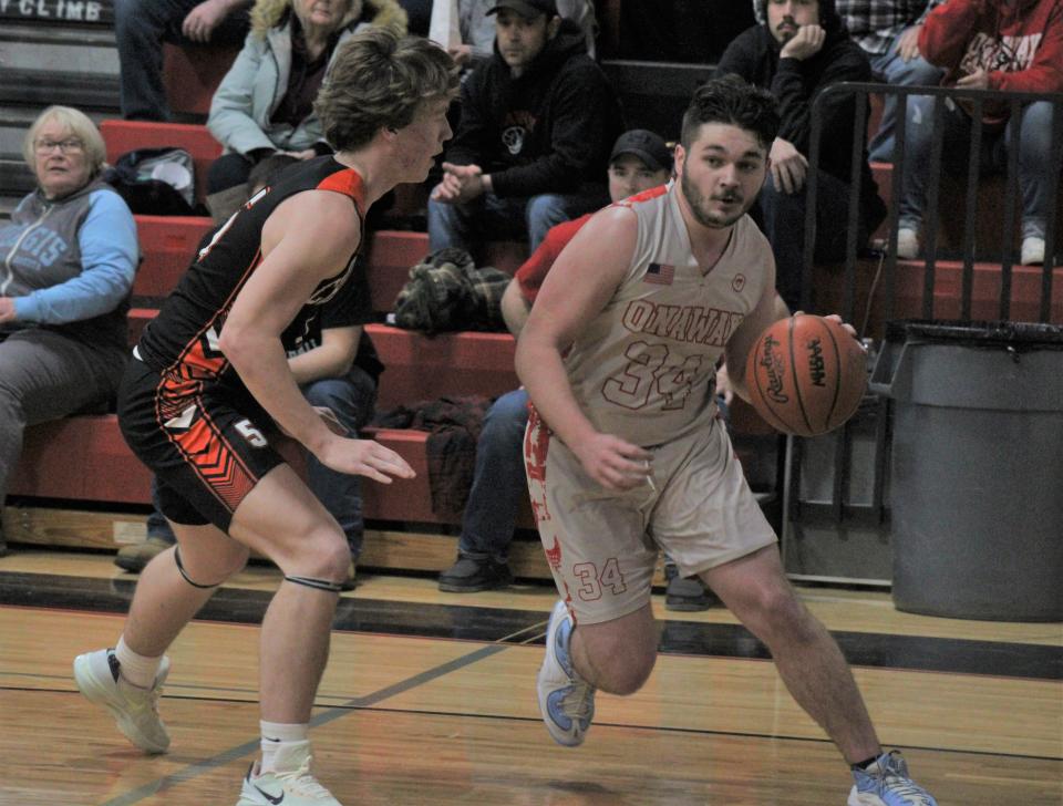 Onaway junior Justin Kramer-St. Germain (34) looks to get past Cheboygan junior Caden Gardner during Friday night's boys basketball clash in Onaway.