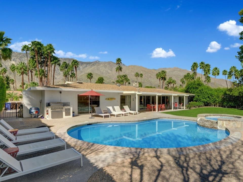 the exterior and pool of Disney's Palm Springs vacation home