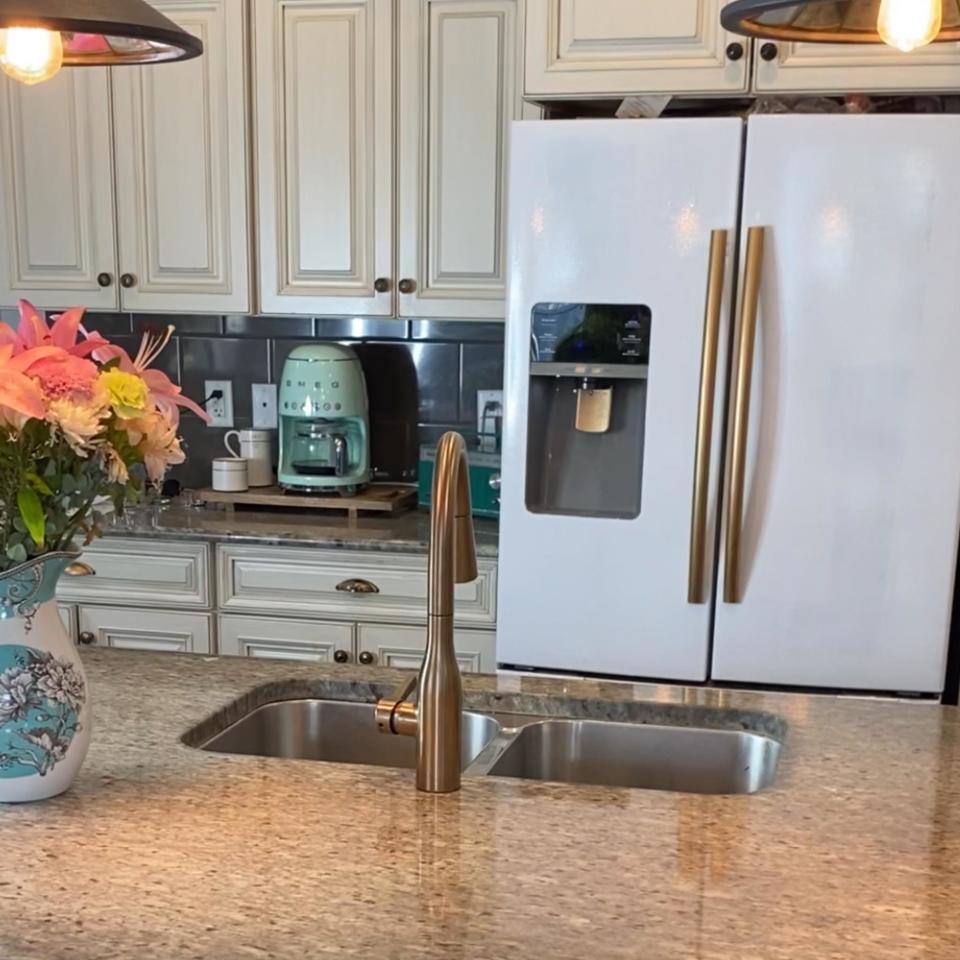 a fridge painted in white and gold