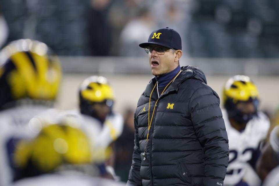 Michigan coach Jim Harbaugh watches during warmups before game against Michigan State, Saturday, Oct. 21, 2023, in East Lansing, Mich. | Al Goldis, Associated Press