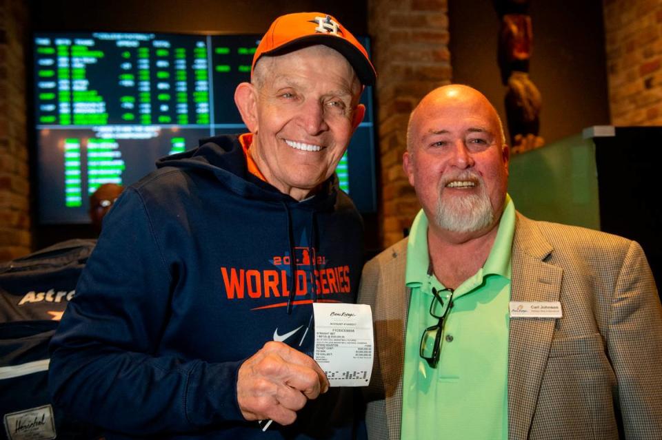 Jim McIngvale, better known as ‘Mattress Mack’, poses with Carl Johnson, sportsbook manager at Beau Rivage Casino, after making a $500,000 bet on the winner of the NCAA Men’s Basketball Tournament at the Beau Rivage Casino in Biloxi on Tuesday, Nov. 15, 2022. If McIngvale wins, he’ll get a payout of $5,500,000.