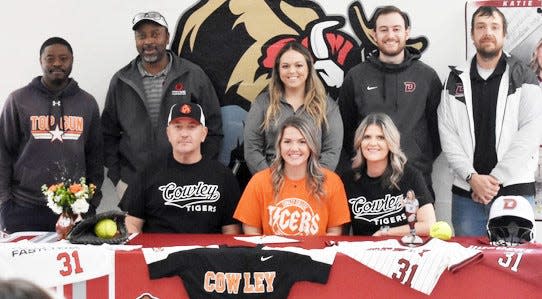Joining Katie Wright (seated, second from right) for her letter of intent signing are, from left: Seated — Aaron Wright, left, and Crystal Wright, right; and Standing — Doniva Downing, Chris Townsend, Niki Keck, Michael Sanders and Riley Allen.