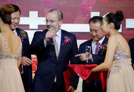 FIBA Secretary General Patrick Baumann and Wang Jianlin (R), chairman of the Wanda Group, attend a signing ceremony in Beijing, China June 16, 2016. REUTERS/Jason Lee