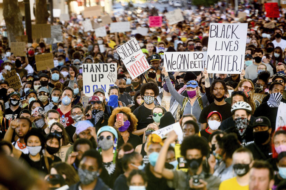 Several thousand demonstrators gather in Oakland, Calif., on Monday, June 1, 2020, to protest the death of George Floyd, who died after being restrained by Minneapolis police officers on May 25. (AP Photo/Noah Berger)